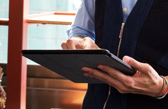 Businessman accessing better business funding with HSBC on a tablet