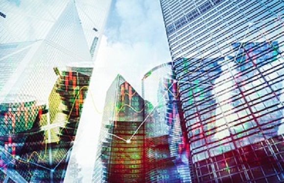 Buildings overlayed with an image of stocks
