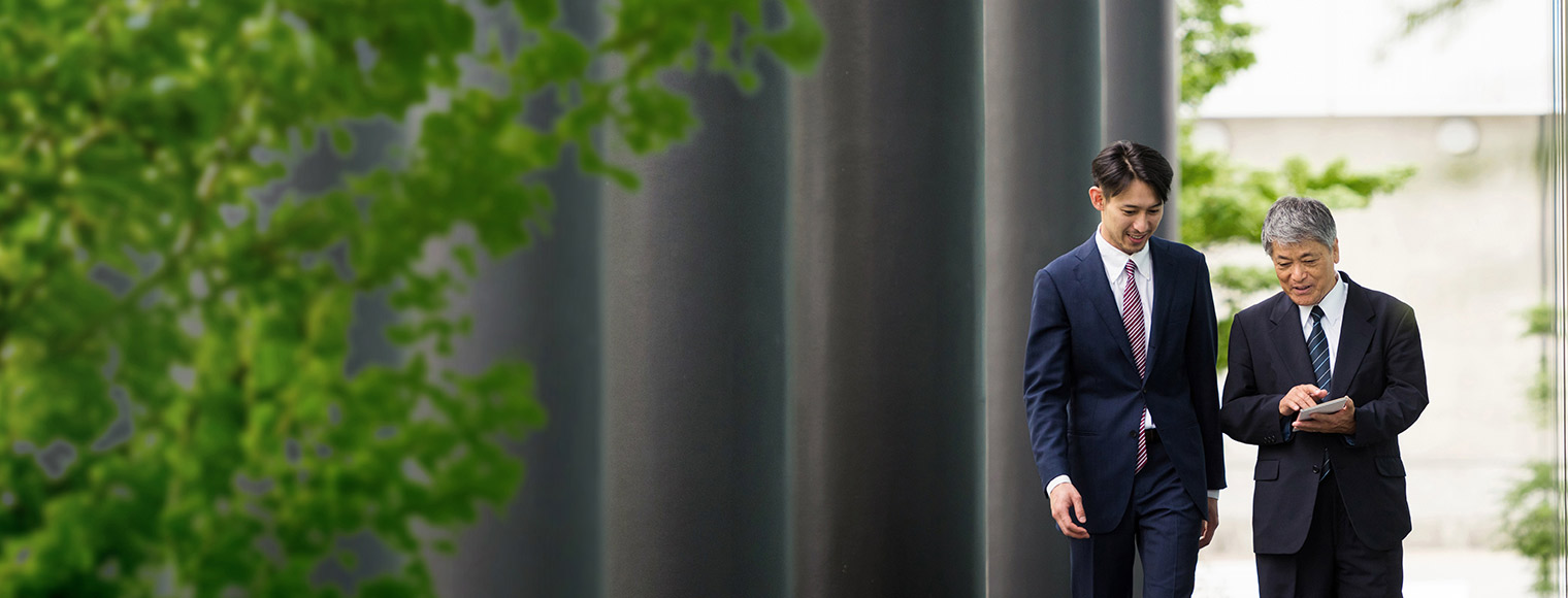 Businessman discussing plans with a HSBC beyond banking advisor Businessman discussing plans with a HSBC beyond banking advisor