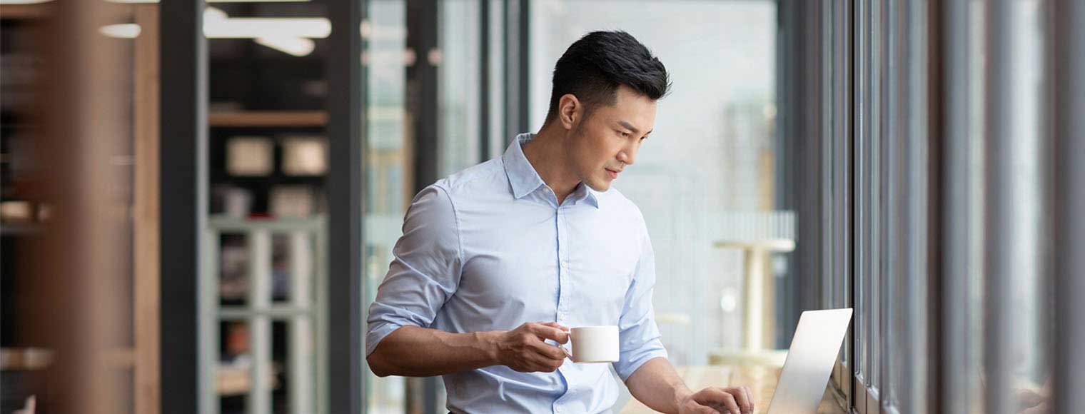 Man accessing HSBC Global Wallet on his laptop Man accessing HSBC Global Wallet on his laptop