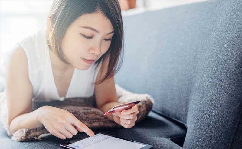 Woman using HSBC Omni Collect on ecommetce for online card payment Woman using HSBC Omni Collect on ecommetce for online card payment