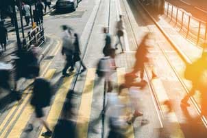 People crossing on busy pedestrian lane People crossing on busy pedestrian lane